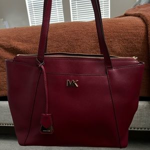 Lightly used red Michael kors handbag